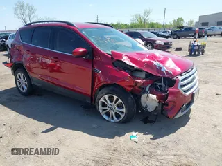 2018 Ford Escape SE z VIN 1FMCU9G9XJUB49208, wystawiony jako IAAI lot #41967550 z przebiegiem 119 087 mil mil oraz . Historia ofert i sprzedaży dostępna na DreamBid. Obrazek 1.
