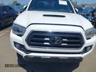2021 Toyota Tacoma 4WD SR5 with VIN 3TMDZ5BN4MM106693, listed as a IAAI auction lot 41986838 with 52,510 mi miles. Bid and sale history available at carsss.com. Image 6.