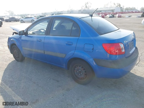 2009 Kia Rio with VIN KNADE223296502151, listed as a IAAI auction lot 41602918 with 143,996 mi miles. Bid and sale history available at carsss.com. Image 3.