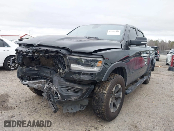 2019 Ram 1500 Rebel z VIN 1C6SRFLT1KN722064, wystawiony jako IAAI lot #41513201 z przebiegiem 113 559 mil mil oraz . Historia ofert i sprzedaży dostępna na DreamBid. Obrazek 2.