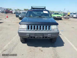 1995 Jeep Grand Cherokee Laredo with VIN 1J4GZ58Y2SC669152, listed as a IAAI auction lot 42077067 with 134,022 mi miles. Bid and sale history available at carsss.com. Image 6.