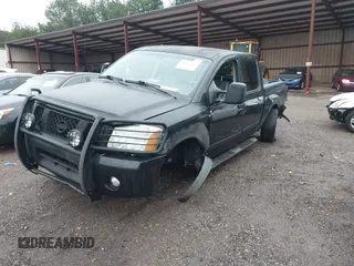 2007 Nissan Titan SE with VIN 1N6BA07A17N212890, listed as a IAAI auction lot 41034412 with 211,881 mi miles and . Bid and sale history available at DreamBid. Image 6.
