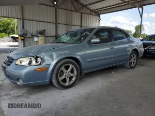2000 Nissan Maxima GXE with VIN JN1CA31A1YT223132, listed as a Copart auction lot 60148655 with 269,258 mi miles and Salvage title. Bid and sale history available at DreamBid. Image 1.