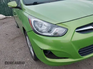 2013 Hyundai Accent SE with VIN KMHCU5AEXDU069586, listed as a IAAI auction lot 40968974 with 98,939 mi miles. Bid and sale history available at carsss.com. Image 12.