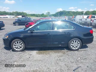 2014 Volkswagen Jetta SE with VIN 3VWD17AJ4EM429576, listed as a IAAI auction lot 42542604 with 142,313 mi miles and . Bid and sale history available at DreamBid. Image 14.