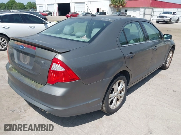 2012 Ford Fusion SE with VIN 3FAHP0HA4CR203446, listed as a IAAI auction lot 42093330 with 185,703 mi miles. Bid and sale history available at carsss.com. Image 4.