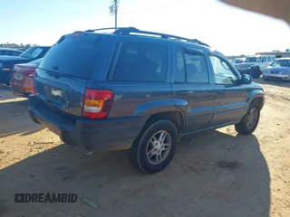 2004 Jeep Grand Cherokee Laredo z VIN 1J4GW48S24C159370, wystawiony jako IAAI lot #41296094 z przebiegiem 138 296 mil mil oraz . Historia ofert i sprzedaży dostępna na DreamBid. Obrazek 4.
