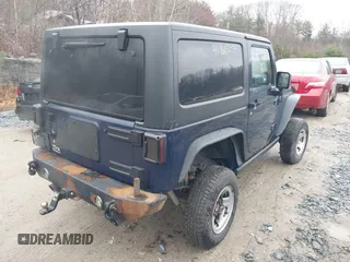 2013 Jeep Wrangler Rubicon 10th Anniversary with VIN 1C4BJWCG7DL544145, listed as a IAAI auction lot 41965259 with 125,900 mi miles and . Bid and sale history available at carsss.com. Image 4.