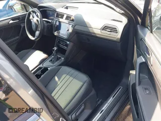2023 Volkswagen Tiguan SE R-Line Black with VIN 3VVCB7AX8PM036684, listed as a IAAI auction lot 42169004 with 25,024 mi miles and . Bid and sale history available at DreamBid. Image 5.