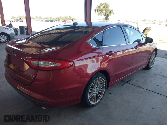 2013 Ford Fusion SE Hybrid z VIN 3FA6P0LU9DR183625, wystawiony jako IAAI lot #42338533 z przebiegiem 159 546 mil mil oraz . Historia ofert i sprzedaży dostępna na DreamBid. Obrazek 4.