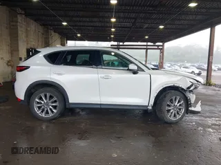 2019 Mazda CX-5 Grand Touring with VIN JM3KFBDMXK0648813, listed as a IAAI auction lot 42524680 with 23,521 mi miles and . Bid and sale history available at DreamBid. Image 14.