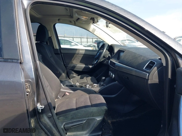 2016 Mazda CX-5 Touring with VIN JM3KE4CY3G0672977, listed as a IAAI auction lot 41889137 with 130,593 mi miles. Bid and sale history available at carsss.com. Image 5.
