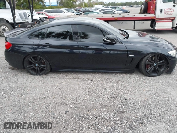 2015 BMW 4 Series 435i with VIN WBA4B1C5XFD955119, listed as a IAAI auction lot 41349918 with 181,937 mi miles and . Bid and sale history available at carsss.com. Image 14.