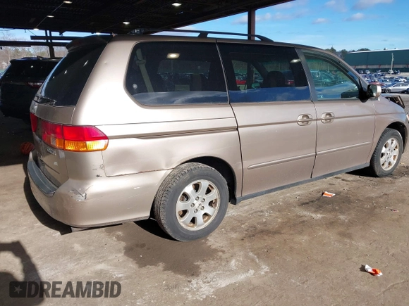 2004 Honda Odyssey EX-RES z VIN 5FNRL18874B127785, wystawiony jako IAAI lot #41141221 z przebiegiem 151 036 mil mil oraz . Historia ofert i sprzedaży dostępna na DreamBid. Obrazek 4.