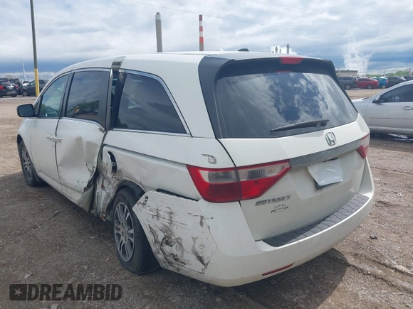 2012 Honda Odyssey EX-L with VIN 5FNRL5H63CB117341, listed as a IAAI auction lot 42197815 with 256,544 mi miles and . Bid and sale history available at DreamBid. Image 3.