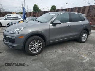 2016 Porsche Cayenne with VIN WP1AA2A21GKA15990, listed as a Copart auction lot 61808045 with 142,828 mi miles and Salvage title. Bid and sale history available at DreamBid. Image 1.