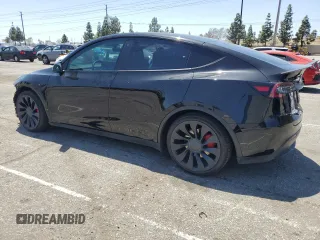 2022 Tesla Model Y Performance z VIN 7SAYGDEF2NF443037, wystawiony jako Copart lot #56870145 z przebiegiem 51 897 mil mil oraz Szkoda całkowita • Salvage title. Historia ofert i sprzedaży dostępna na DreamBid. Obrazek 2.