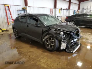 2018 Toyota C-HR XLE z VIN NMTKHMBX0JR041387, wystawiony jako Copart lot #57050385 z przebiegiem Nie podano mil oraz Szkody całkowita. Historia ofert i sprzedaży dostępna na DreamBid. Obrazek 4.