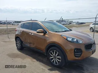 2019 Kia Sportage EX z VIN KNDPNCAC5K7590541, wystawiony jako IAAI lot #42043055 z przebiegiem 92 337 mil mil oraz . Historia ofert i sprzedaży dostępna na DreamBid. Obrazek 1.