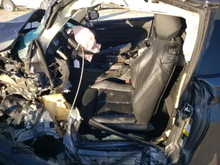 2018 BMW M2 z VIN WBS1J5C50J7B70191, wystawiony jako Copart lot #86976284 z przebiegiem Nie podano mil oraz Szkoda całkowita • Salvage title. Historia ofert i sprzedaży dostępna na DreamBid. Obrazek 7.