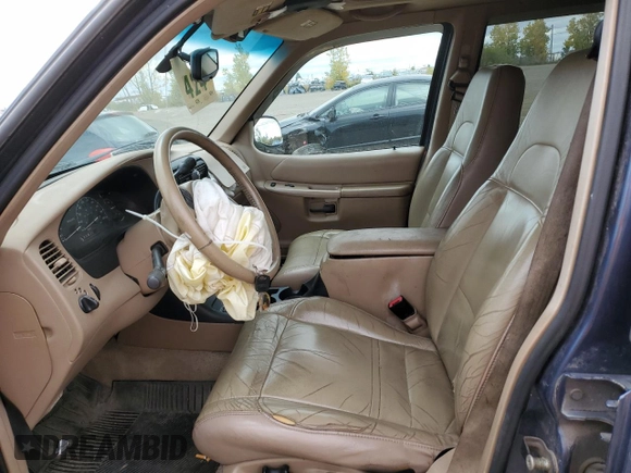 2000 Ford Explorer Eddie Bauer with VIN 1FMZU74E4YZA75510, listed as a Copart auction lot 75601964 with 196,180 mi miles and Salvage title. Bid and sale history available at DreamBid. Image 7.