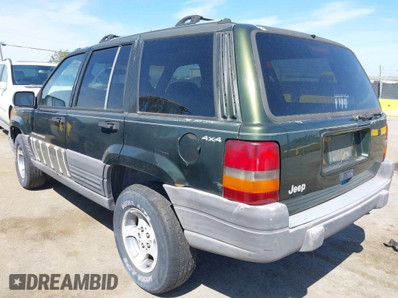 1996 Jeep Grand Cherokee Laredo with VIN 1J4GZ58S7TC280276, listed as a IAAI auction lot 42120454 with 230,617 mi miles. Bid and sale history available at carsss.com. Image 3.