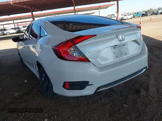 2020 Honda Civic LX with VIN 19XFC2F66LE007328, listed as a IAAI auction lot 41852111 with 135,956 mi miles and . Bid and sale history available at DreamBid. Image 6.
