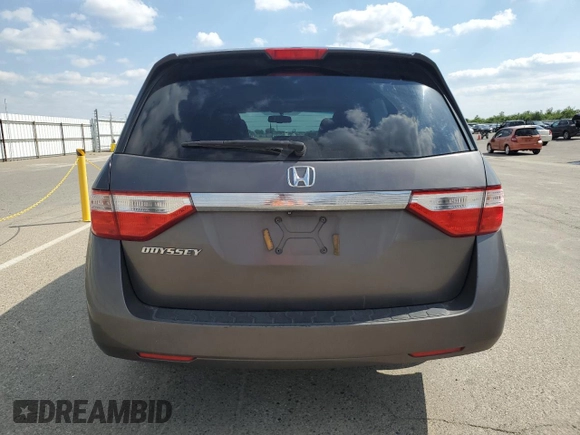 2011 Honda Odyssey EX-L with VIN 5FNRL5H61BB056652, listed as a Copart auction lot 54774015 with 233,125 mi miles and Salvage Title. Bid and sale history available at DreamBid. Image 6.
