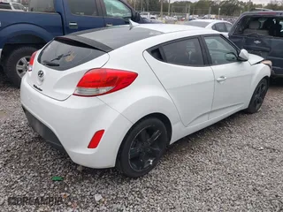 2014 Hyundai Veloster with VIN KMHTC6AD7EU217470, listed as a IAAI auction lot 41286296 with 150,034 mi miles. Bid and sale history available at carsss.com. Image 4.