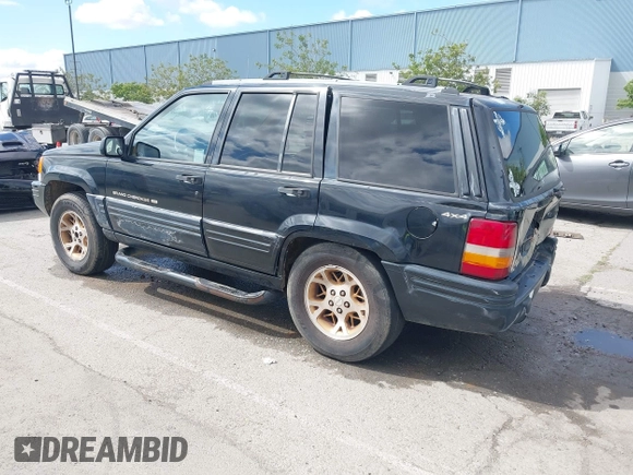 1996 Jeep Grand Cherokee Limited z VIN 1J4GZ78Y3TC191000, wystawiony jako IAAI lot #42259621 z przebiegiem 212 690 mil mil oraz . Historia ofert i sprzedaży dostępna na DreamBid. Obrazek 3.