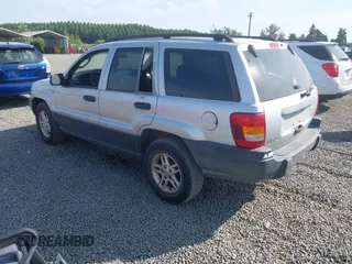 2004 Jeep Grand Cherokee Laredo z VIN 1J4GW48S34C272700, wystawiony jako IAAI lot #42494918 z przebiegiem 214 843 mil mil oraz . Historia ofert i sprzedaży dostępna na DreamBid. Obrazek 3.