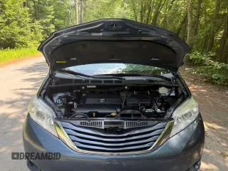 2015 Toyota Sienna LE AAS with VIN 5TDKK3DC1FS623710, listed as a Copart auction lot 62335575 with 221,148 mi miles and Clean title. Bid and sale history available at DreamBid. Image 7.