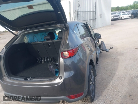 2018 Mazda CX-5 Grand Touring z VIN JM3KFADM5J1365772, wystawiony jako IAAI lot #42251805 z przebiegiem 44 599 mil mil oraz . Historia ofert i sprzedaży dostępna na DreamBid. Obrazek 4.