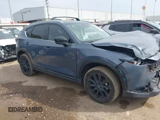 2023 Mazda CX-5 S Carbon Edition z VIN JM3KFBCM6P0288402, wystawiony jako IAAI lot #41682386 z przebiegiem 30 482 mil mil oraz . Historia ofert i sprzedaży dostępna na DreamBid. Obrazek 13.