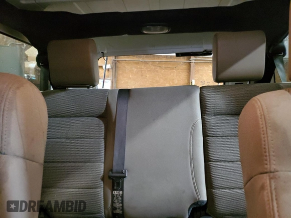 2007 Jeep Wrangler Unlimited Sahara with VIN 1J4GA59197L104784, listed as a Copart auction lot 56700205 with 156,382 mi miles and Salvage title. Bid and sale history available at DreamBid. Image 10.