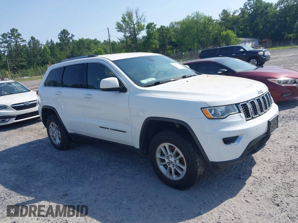 2020 Jeep Grand Cherokee Laredo E with VIN 1C4RJFAG1LC389026, listed as a IAAI auction lot 42261396 with 100,409 mi miles and . Bid and sale history available at DreamBid. Image 1.