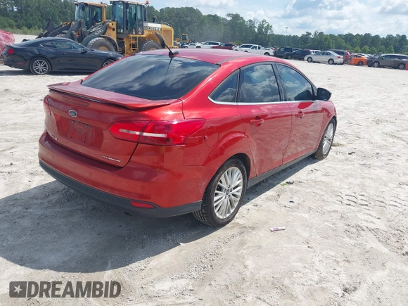 2018 Ford Focus Titanium z VIN 1FADP3J23JL295888, wystawiony jako IAAI lot #42524088 z przebiegiem 108 812 mil mil oraz . Historia ofert i sprzedaży dostępna na DreamBid. Obrazek 4.
