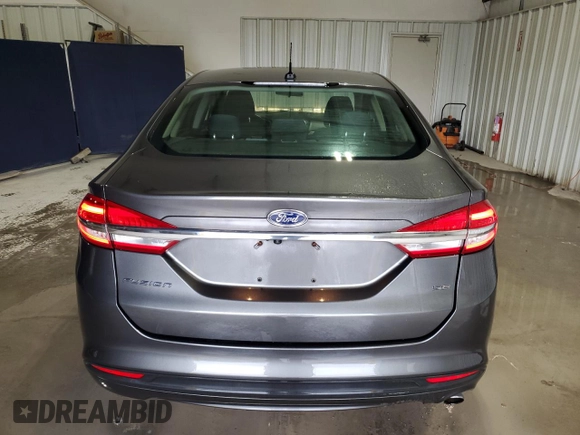 2018 Ford Fusion SE z VIN 3FA6P0H79JR111709, wystawiony jako Copart lot #52972855 z przebiegiem 116 442 mil mil oraz Czysty tytuł • Clean title. Historia ofert i sprzedaży dostępna na DreamBid. Obrazek 6.