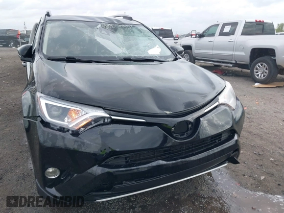 2018 Toyota RAV4 XLE with VIN 2T3WFREV9JW412755, listed as a IAAI auction lot 41889960 with 216,451 mi miles and . Bid and sale history available at carsss.com. Image 6.