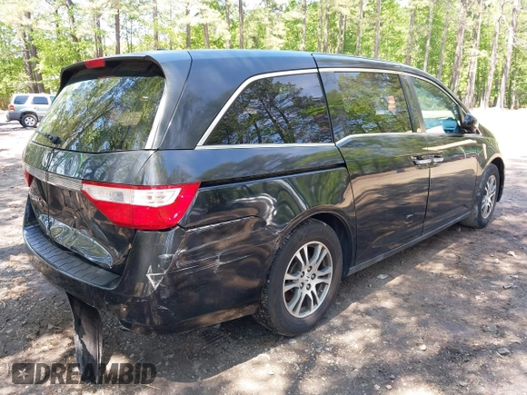 2013 Honda Odyssey EX-L with VIN 5FNRL5H69DB025040, listed as a IAAI auction lot 42078699 with 181,470 mi miles and . Bid and sale history available at carsss.com. Image 4.