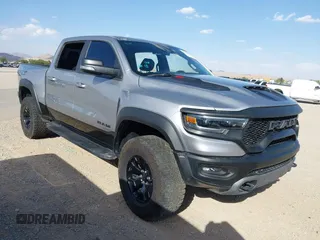 2022 Ram 1500 TRX with VIN 1C6SRFU91NN370644, listed as a IAAI auction lot 42293648 with 14,013 mi miles and . Bid and sale history available at DreamBid. Image 1.