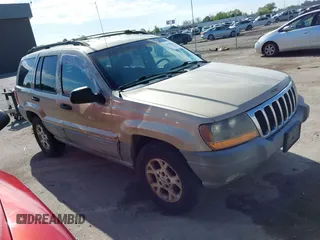 2000 Jeep Grand Cherokee Laredo z VIN 1J4GW48N9YC188395, wystawiony jako IAAI lot #42126742 z przebiegiem 187 170 mil mil oraz . Historia ofert i sprzedaży dostępna na DreamBid. Obrazek 1.