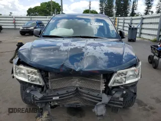 2013 Dodge Journey SE with VIN 3C4PDCAB7DT680055, listed as a Copart auction lot 58241435 with 199,620 mi miles and Salvage title. Bid and sale history available at DreamBid. Image 5.