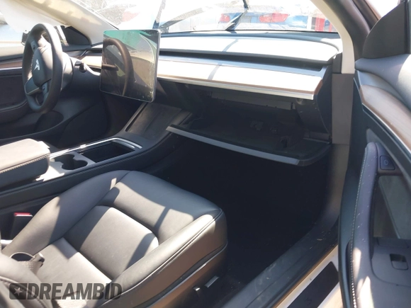 2023 Tesla Model 3 Long Range with VIN 5YJ3E1EB1PF393565, listed as a IAAI auction lot 41656060 with 16,236 mi miles and . Bid and sale history available at DreamBid. Image 5.