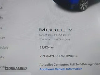 2022 Tesla Model Y Long Range with VIN 7SAYGDEE1NF329909, listed as a IAAI auction lot 41628643 with 32,824 mi miles. Bid and sale history available at carsss.com. Image 7.