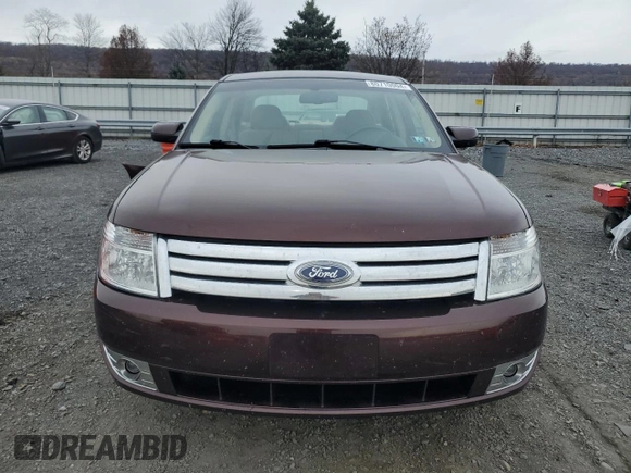 2009 Ford Taurus SE with VIN 1FAHP23W89G125025, listed as a Copart auction lot 80710004 with 114,176 mi miles and Salvage Title. Bid and sale history available at carsss.com. Image 5.