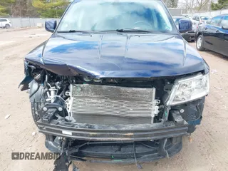 2019 Dodge Journey SE with VIN 3C4PDCBBXKT707700, listed as a IAAI auction lot 42038474 with 57,903 mi miles and . Bid and sale history available at DreamBid. Image 6.