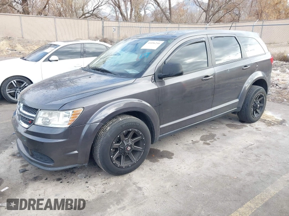 2014 Dodge Journey American Value Pkg with VIN 3C4PDCAB5ET235427, listed as a IAAI auction lot 41056216 with 164,740 mi miles. Bid and sale history available at carsss.com. Image 2.