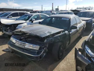 1997 Ford Crown Victoria LX z VIN 2FALP74W2VX169970, wystawiony jako Copart lot #86262044 z przebiegiem 99 535 mil mil oraz Szkoda całkowita • Salvage title. Historia ofert i sprzedaży dostępna na DreamBid. Obrazek 1.