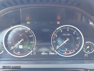 2015 BMW 7 Series 750Li with VIN WBAYE8C50FD781384, listed as a IAAI auction lot 42049829 with 128,087 mi miles. Bid and sale history available at carsss.com. Image 7.